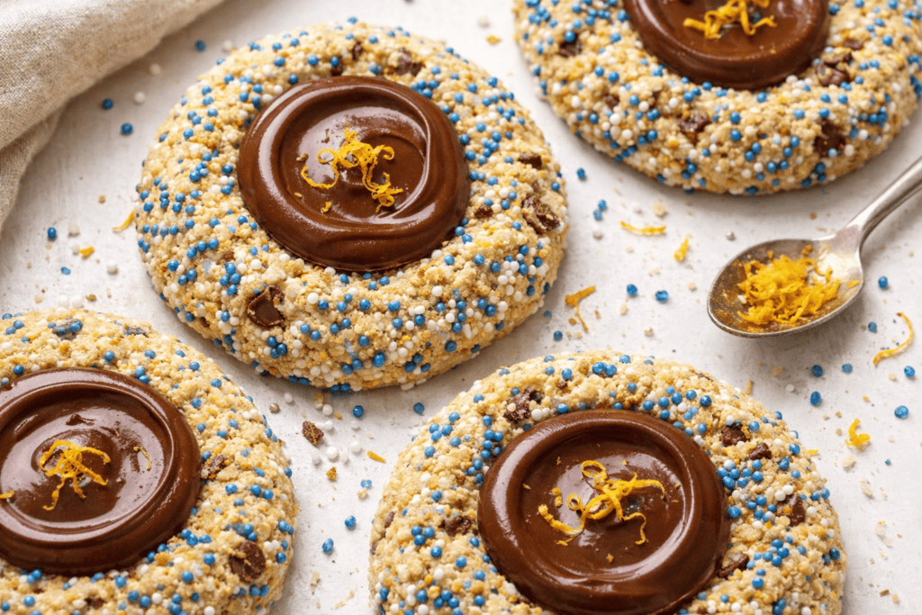 Chocolate thumbprint cookies with lemon zest and colorful sprinkles.