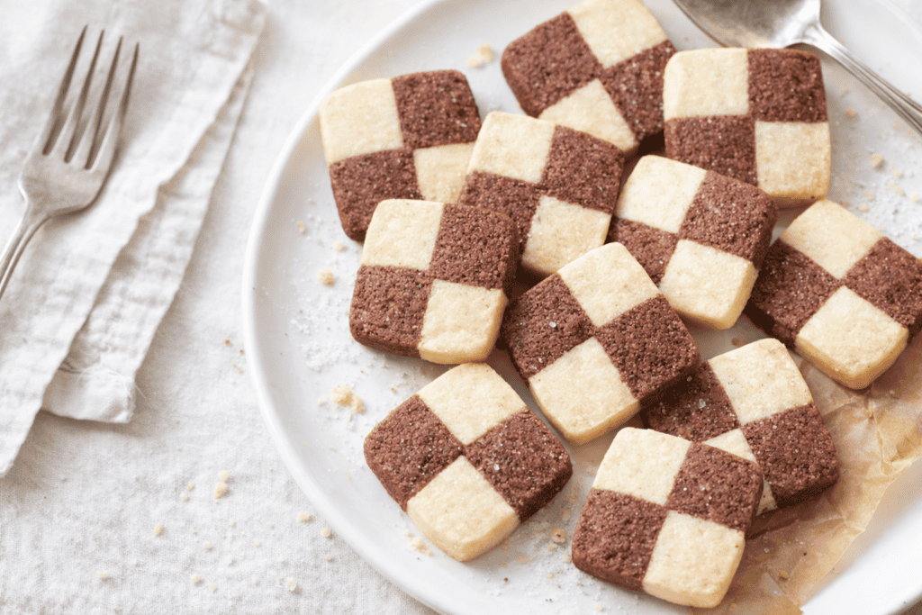 Delicious checkerboard cookies with chocolate and vanilla flavors, perfect for snacks or dessert.