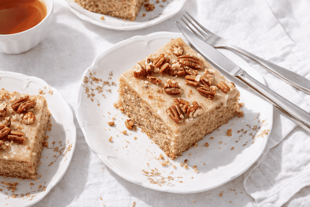 Delicious pecan cake with creamy frosting and crunchy pecan topping. Perfect for dessert or special.